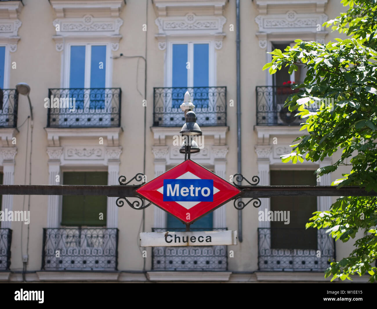 Vintage Metro sign at the Chueca station's entrance. Chueca is a famous station on Line 5 and is well known as Madrid`s LGBT area. Stock Photo